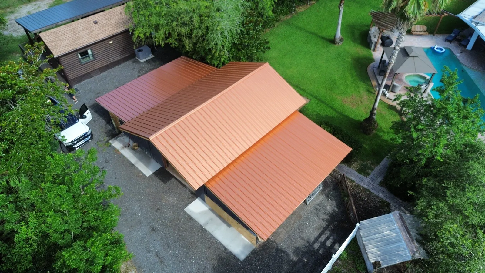Copper-colored PBR metal roof on a re-framed barn in Edgewater